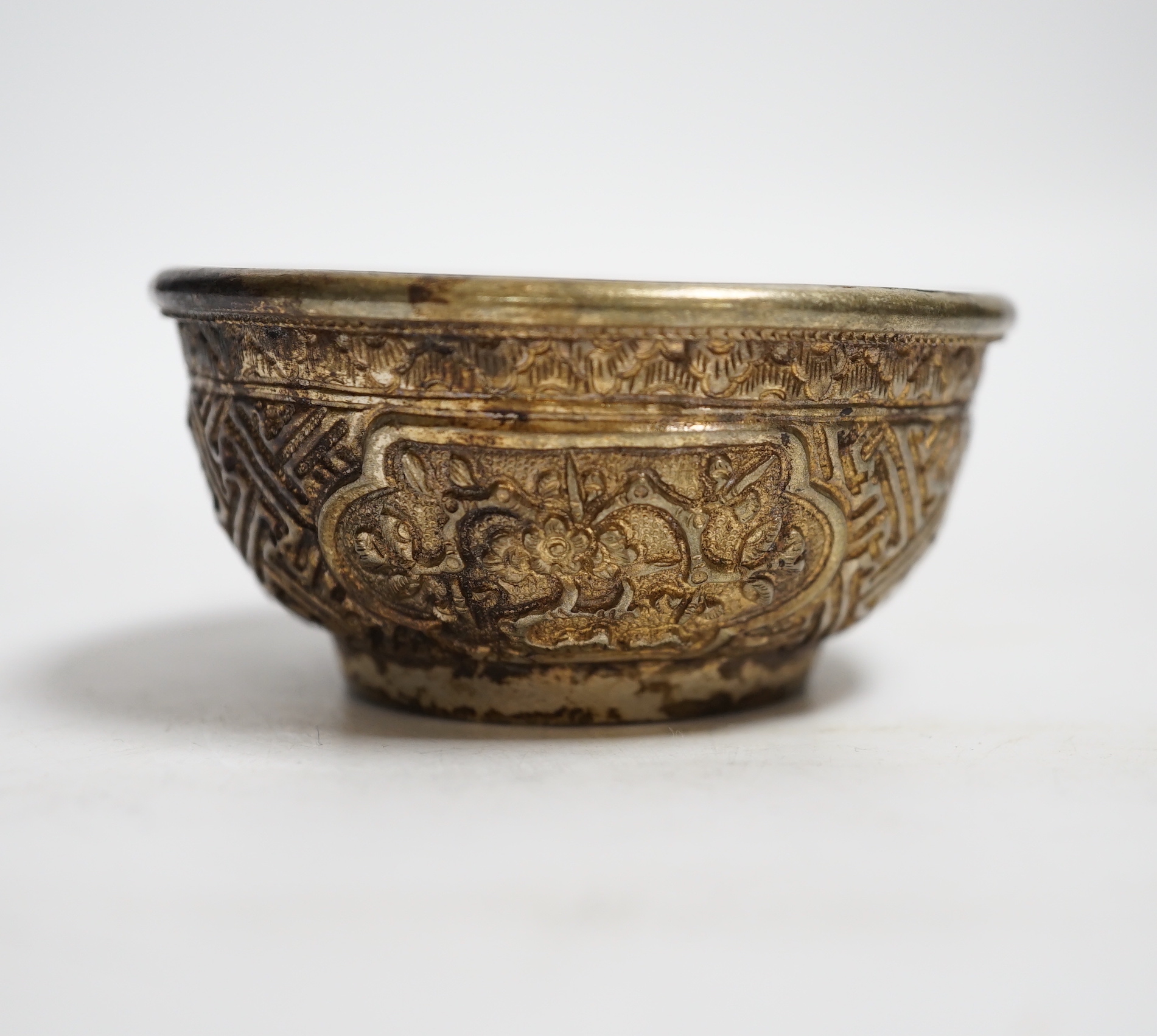 A Nepalese white metal tea bowl, 7.5cm diameter